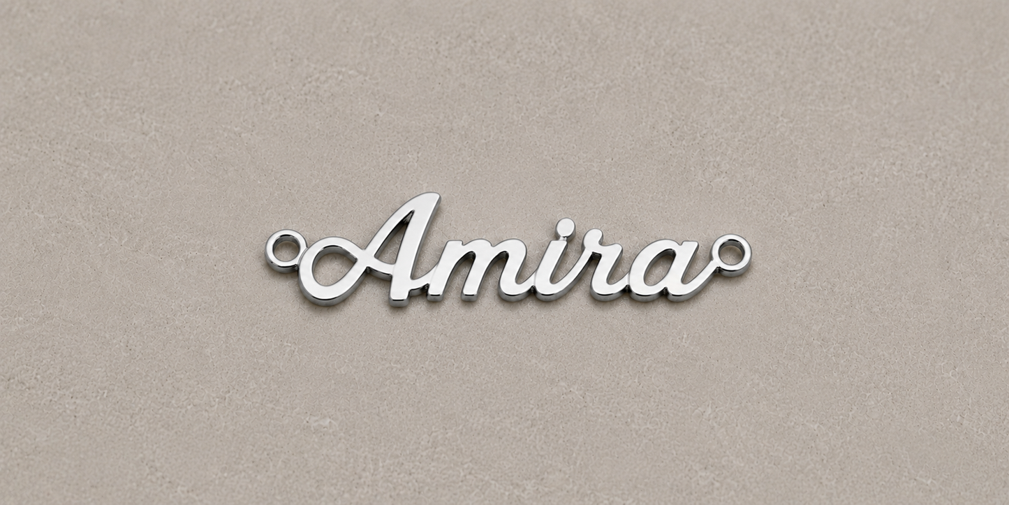 Silver 'Amira' nameplate on a beige background