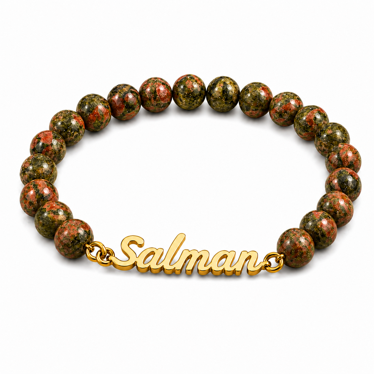 Bracelet with green beads and a gold 'Salman' charm on a white background
