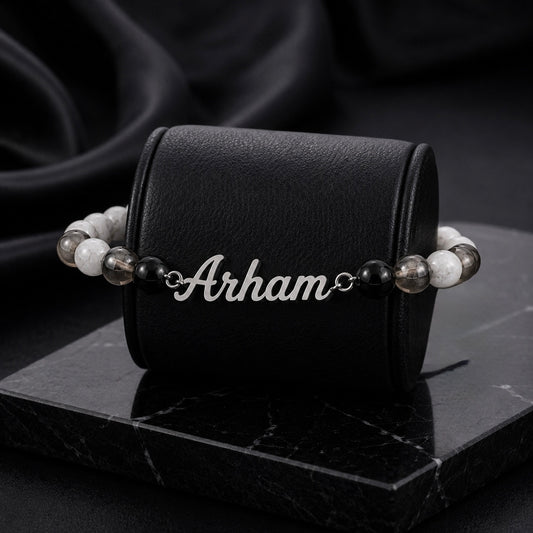 Bracelet with 'Arham' engraving on a black leather case