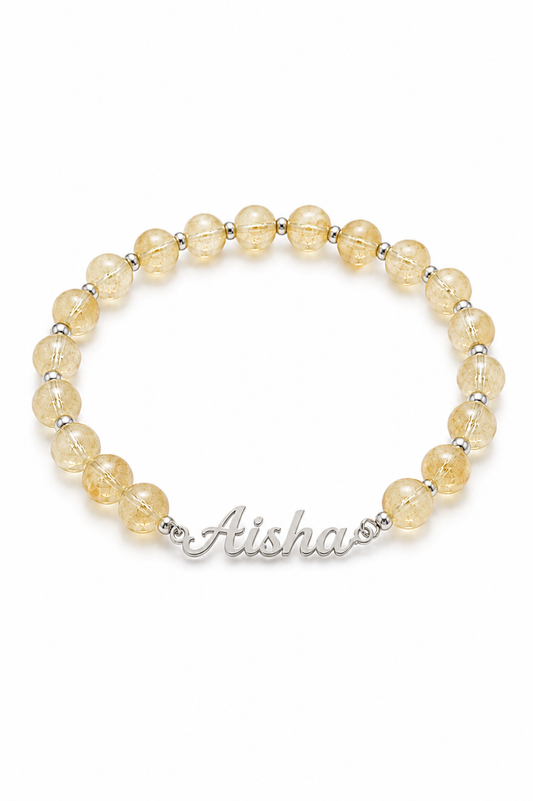 Beaded bracelet with 'Aishas' name on a white background