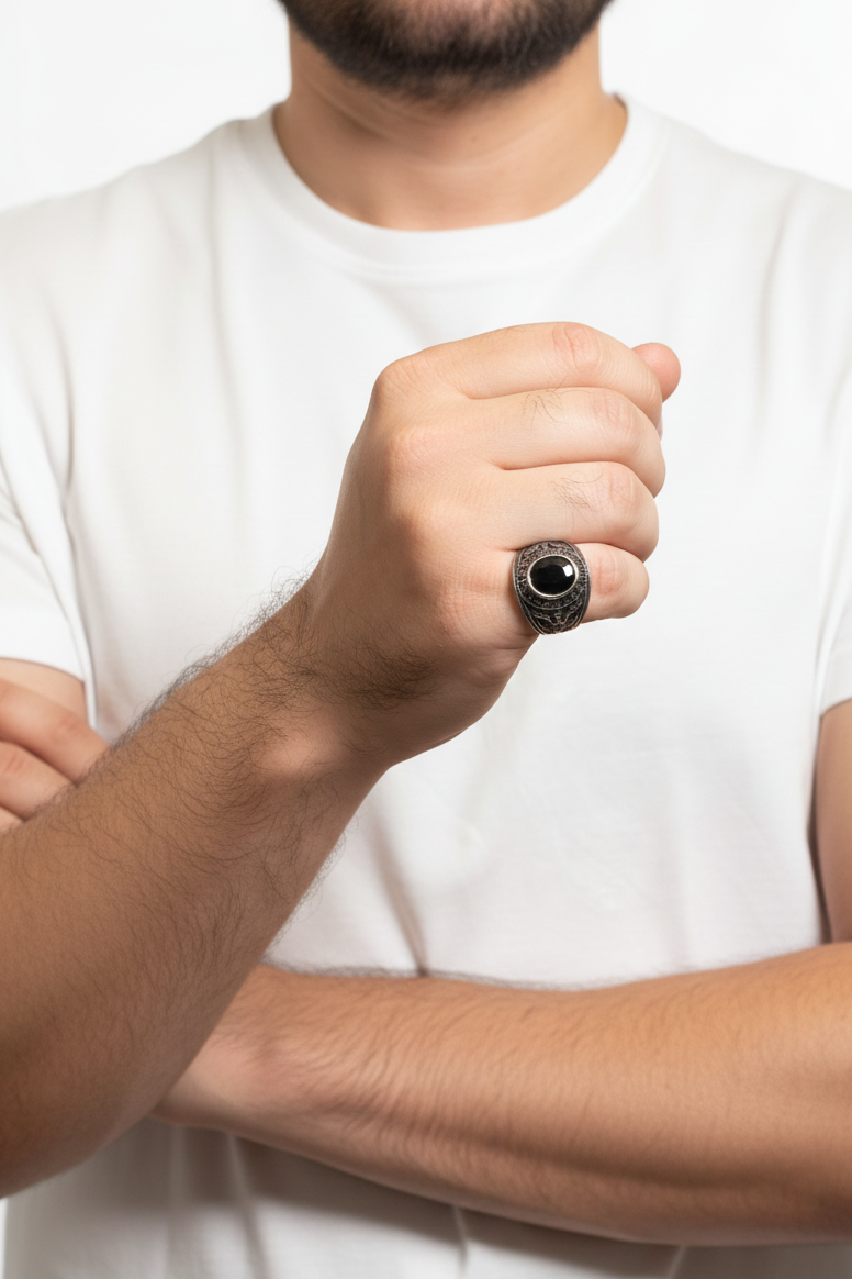 Person wearing a white t-shirt with a black ring on a white background