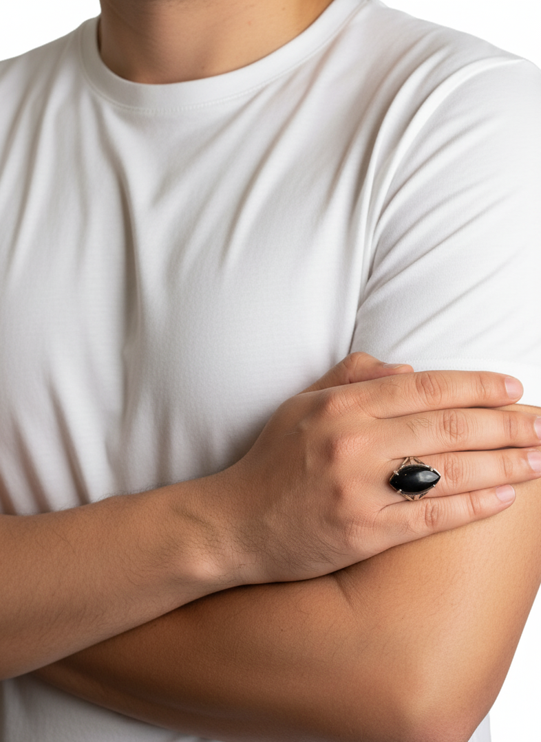 Person wearing a white t-shirt with a black ring on a white background