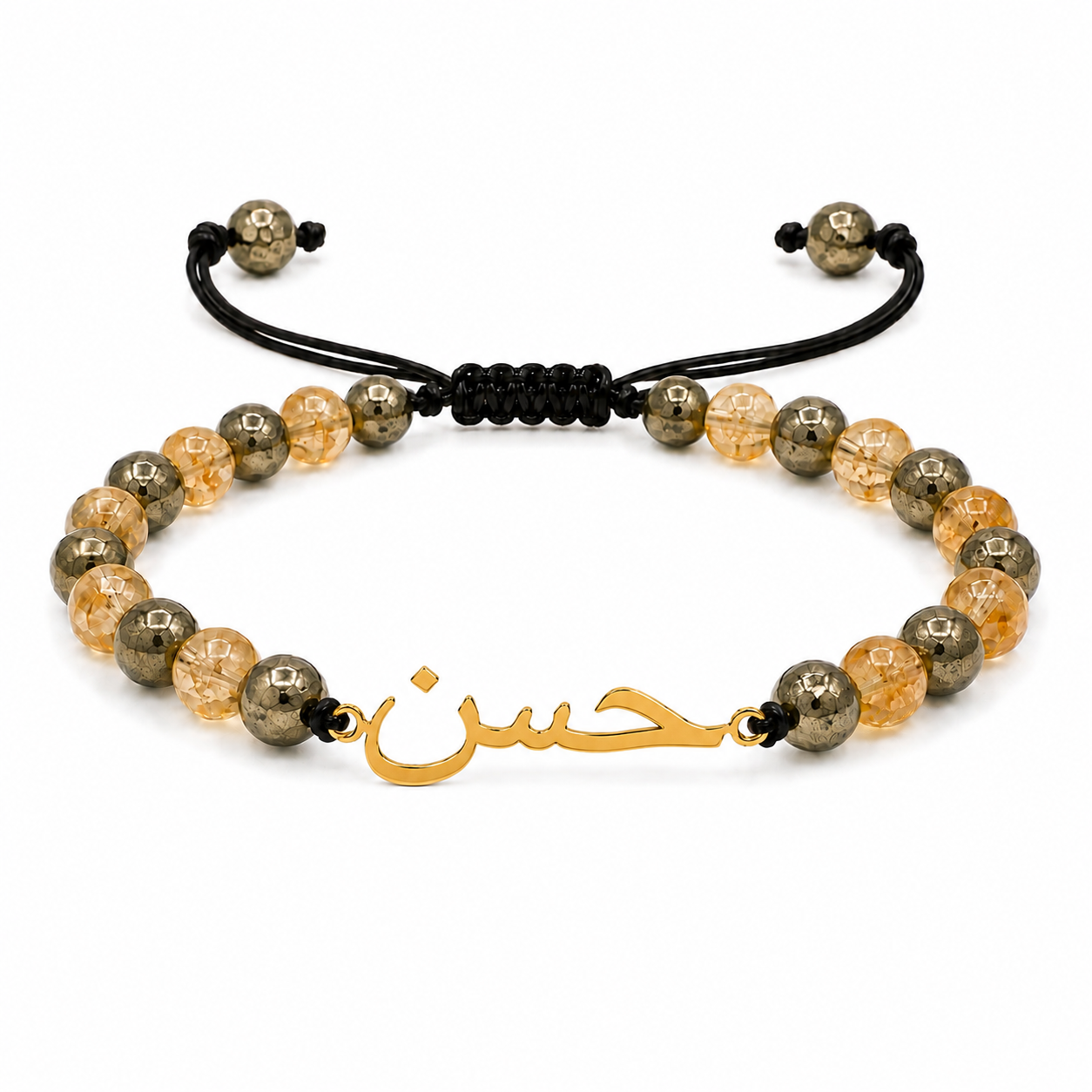 Bracelet with beads and a gold charm on a white background