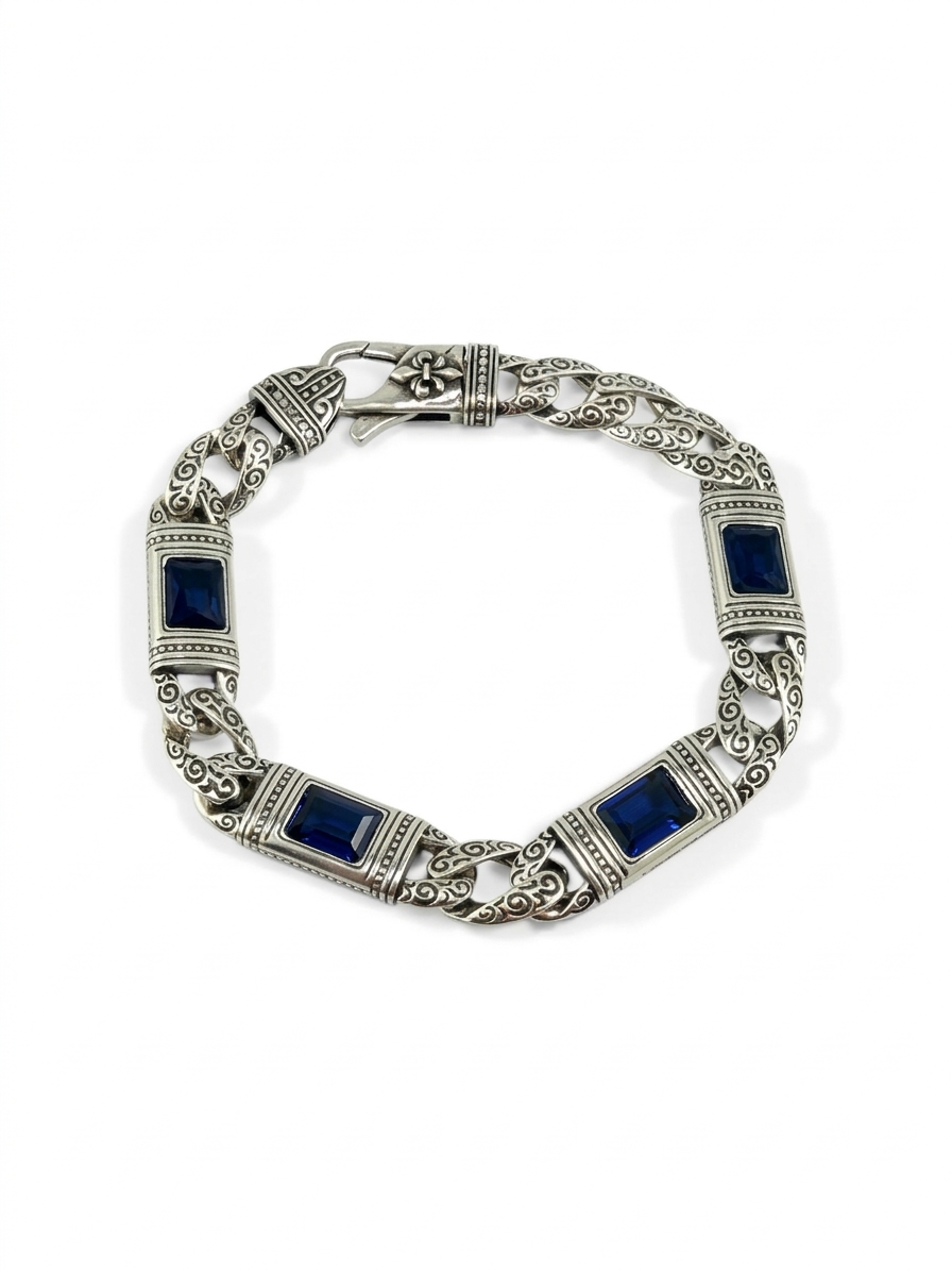 Silver bracelet with blue stones on a white background