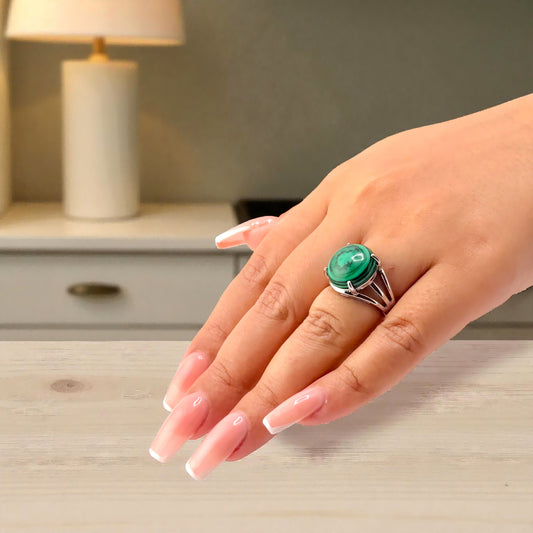 malachite gemstone ring on hand