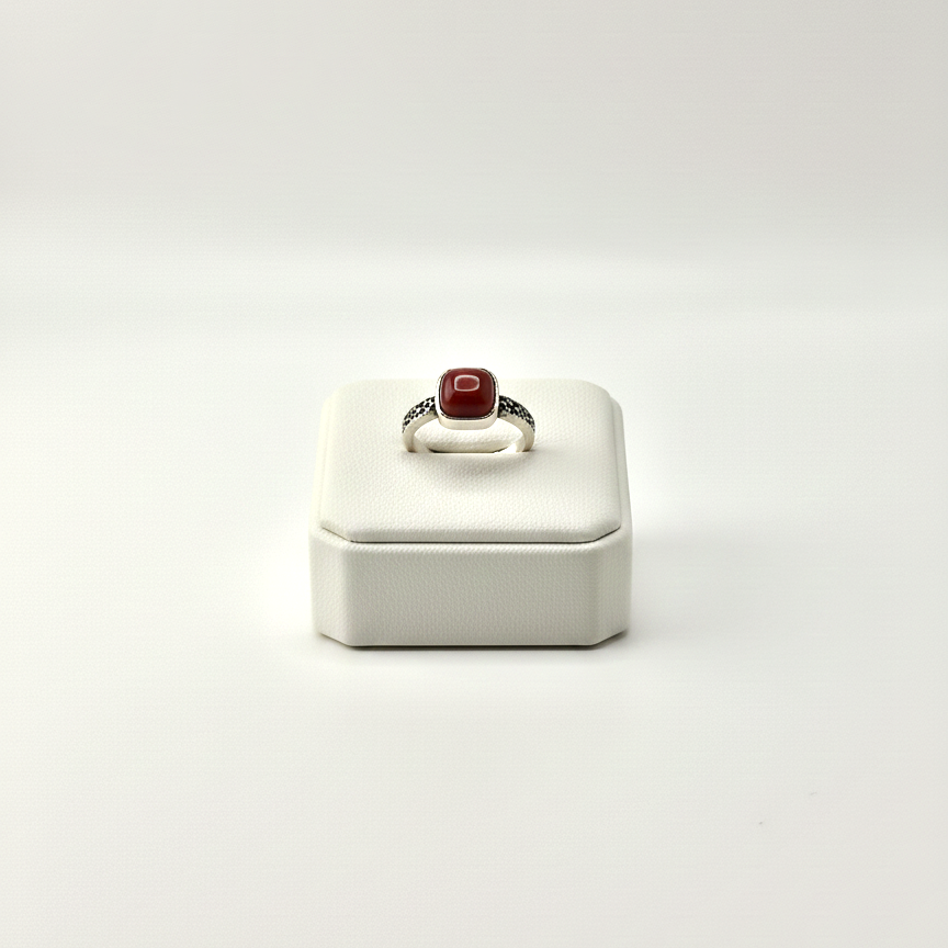 silver red stone ring close up