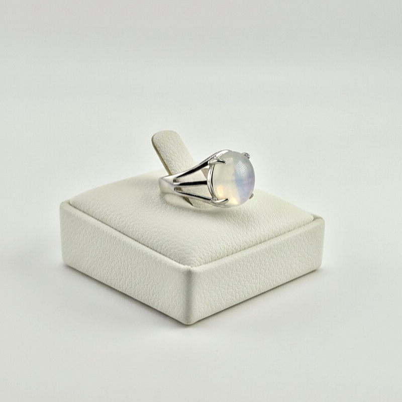 round chalcedony ring on white stand