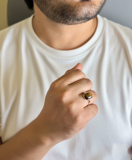 Man wearing natural Tiger Eye male ring in silver finish