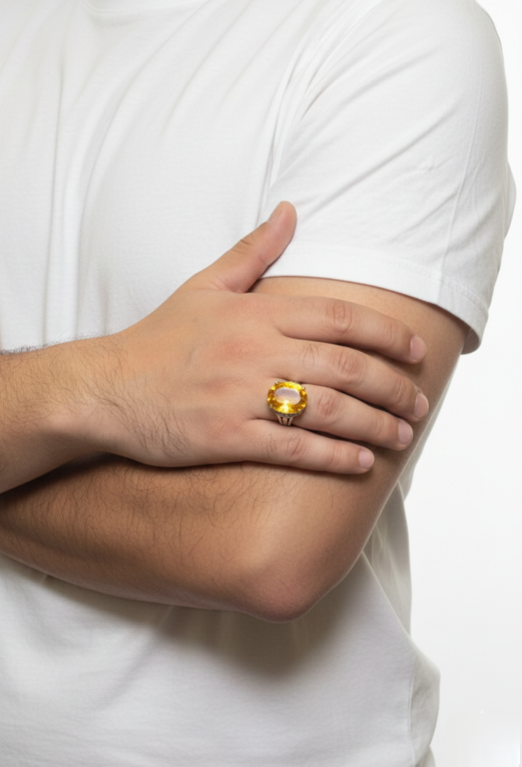 Person wearing a gold ring on a white background