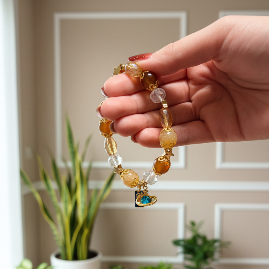 Hand holding a beaded bracelet with a neutral background