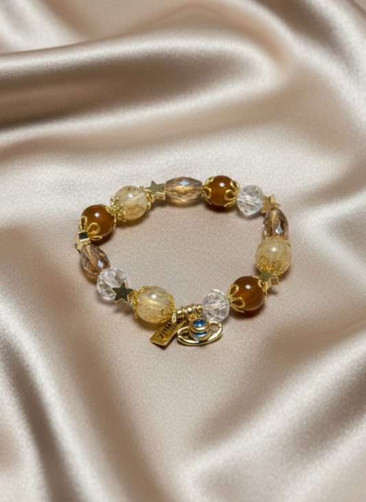 Bracelet with beads on a satin surface