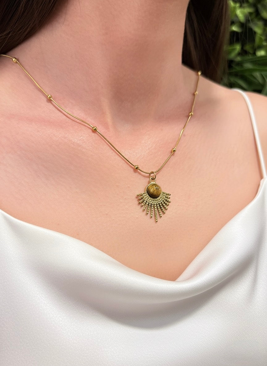 gold plated tiger eye sunburst pendant necklace on model
