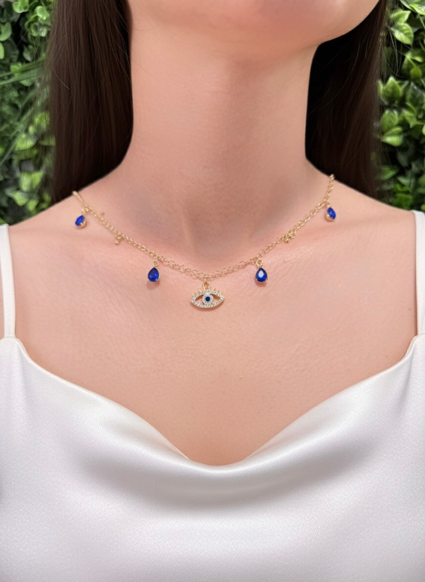 woman wearing blue evil eye pendant necklace with gold plated chain