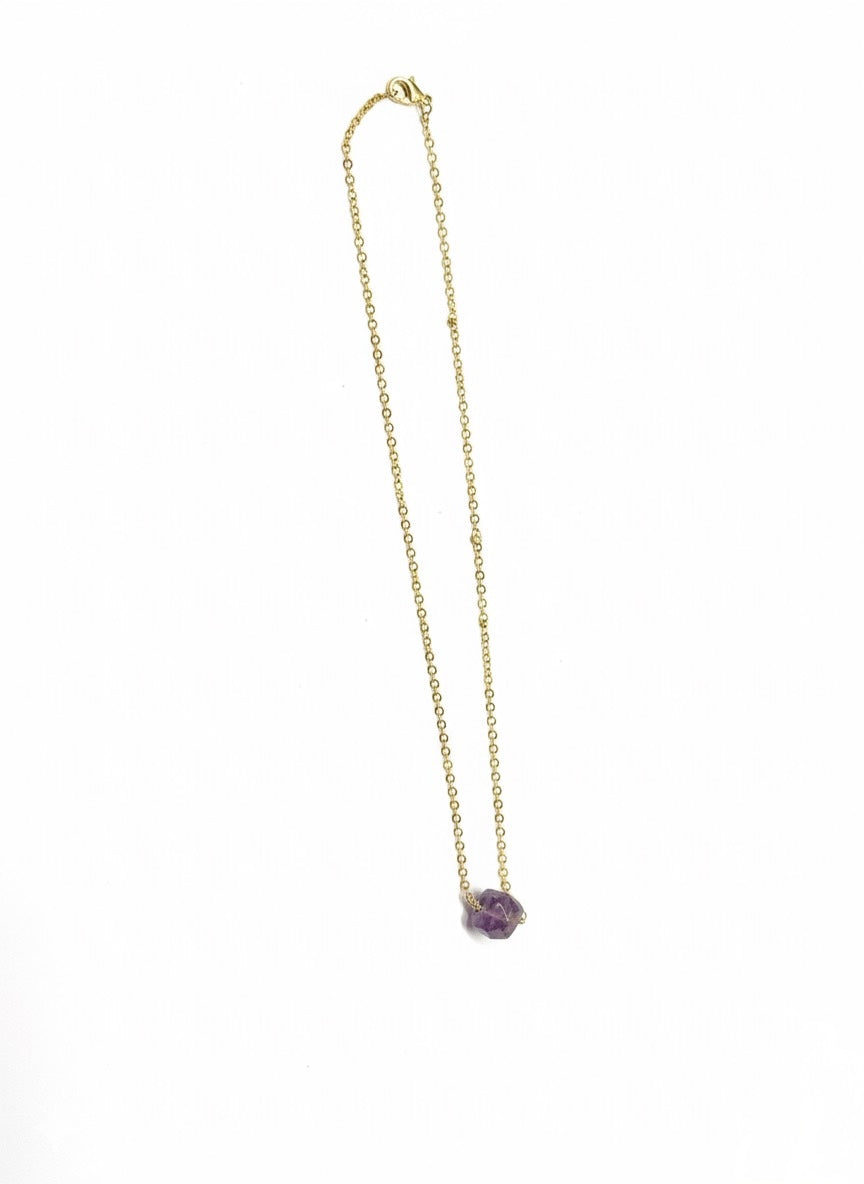 detailed shot of labradorite cube pendant on gold plated chain