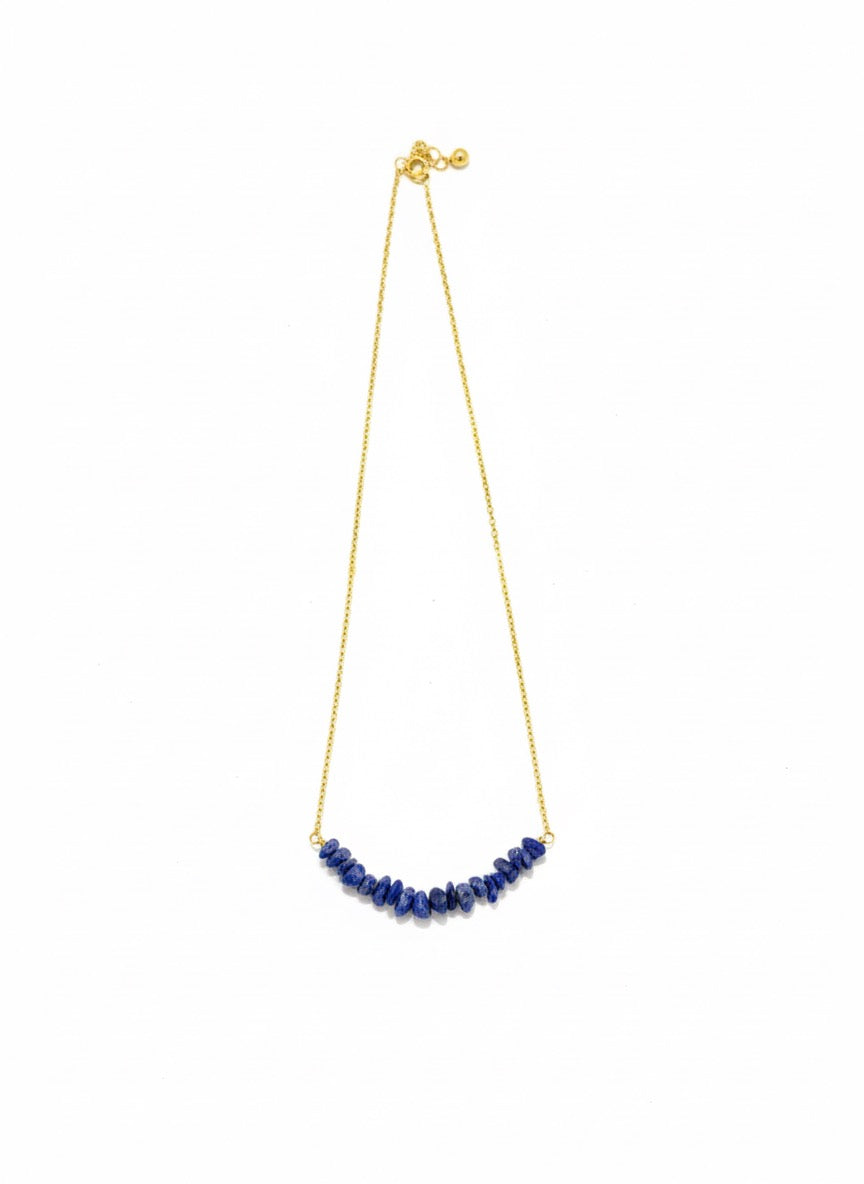 detailed shot of lapis lazuli chips on gold plated necklace