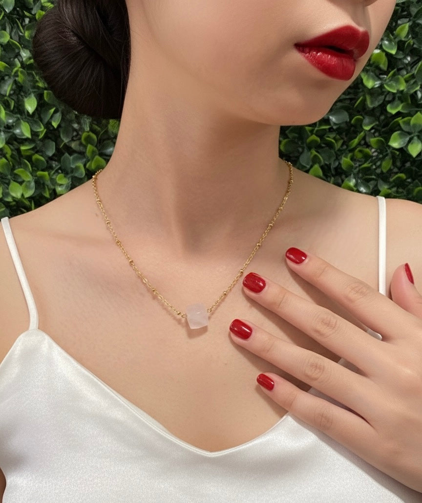 rose quartz cube stone pendant on neckline