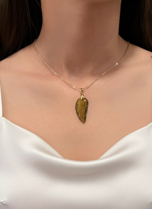gold plated tiger eye angel wing pendant necklace on model