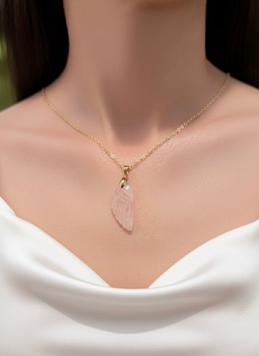 gold plated rose quartz angel wing pendant necklace on model