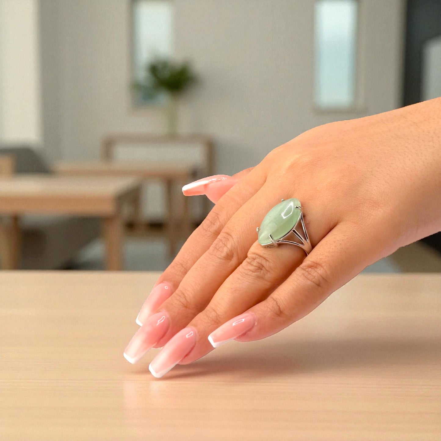 green aventurine marquise ring on hand