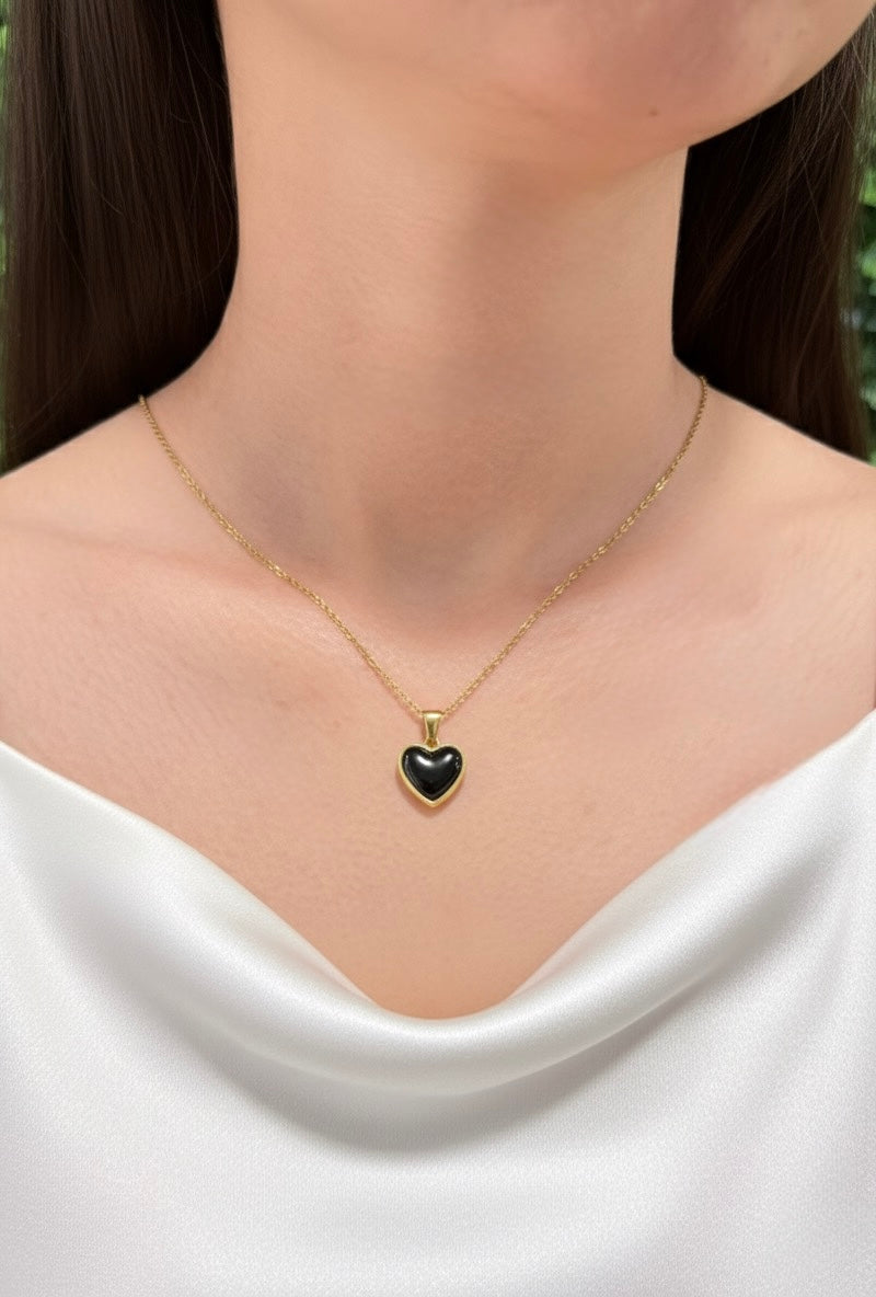 black obsidian heart necklace on model close up