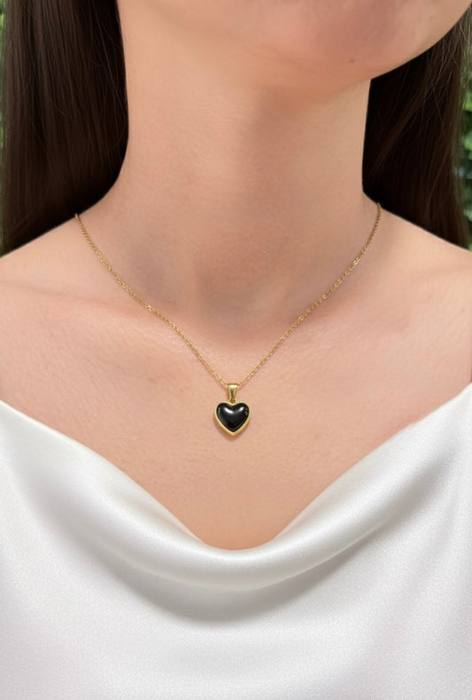 black obsidian heart necklace on model close up
