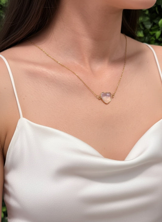 woman wearing moonstone heart necklace