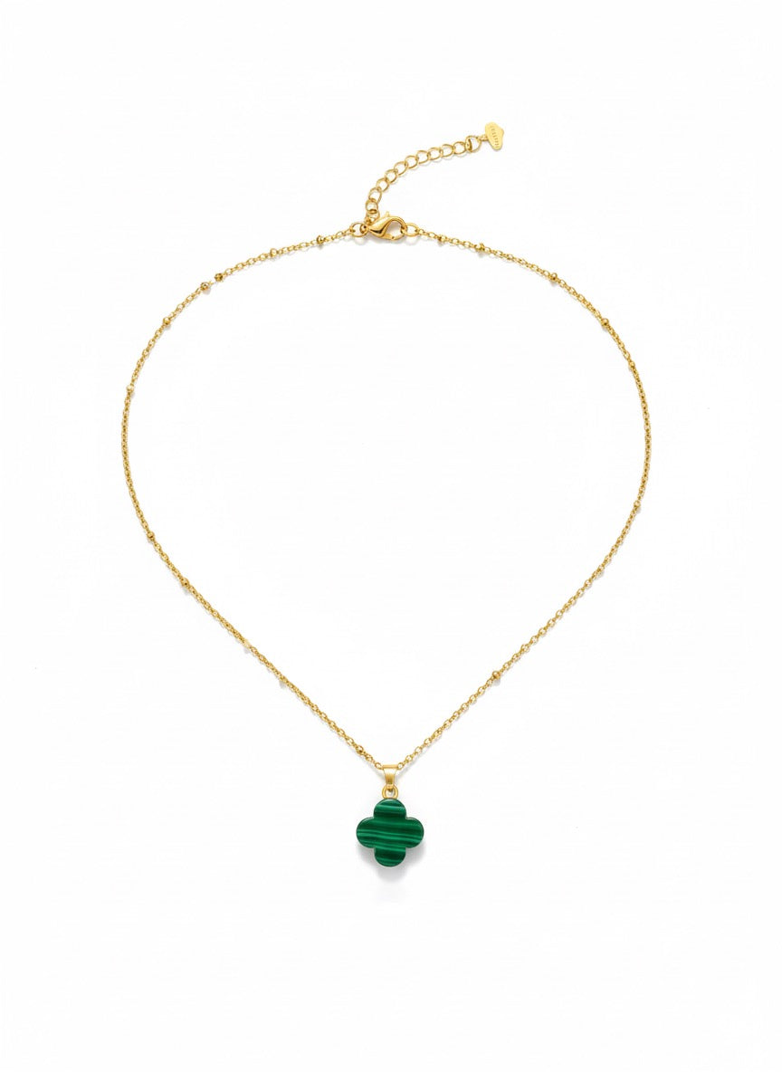 woman wearing malachite clover necklace