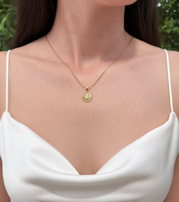 sunburst opal necklace on model