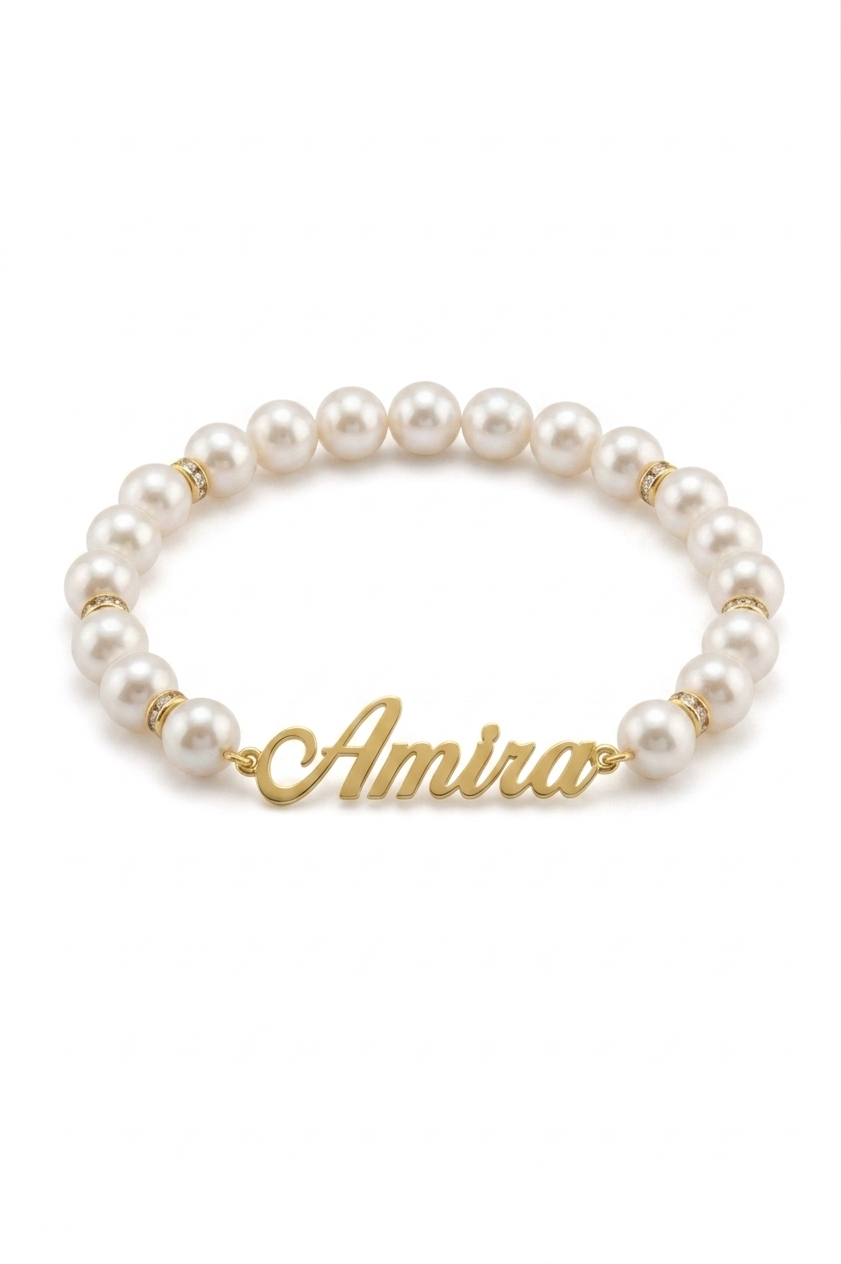 Pearl bracelet with gold accents and 'Amira' charm on a white background