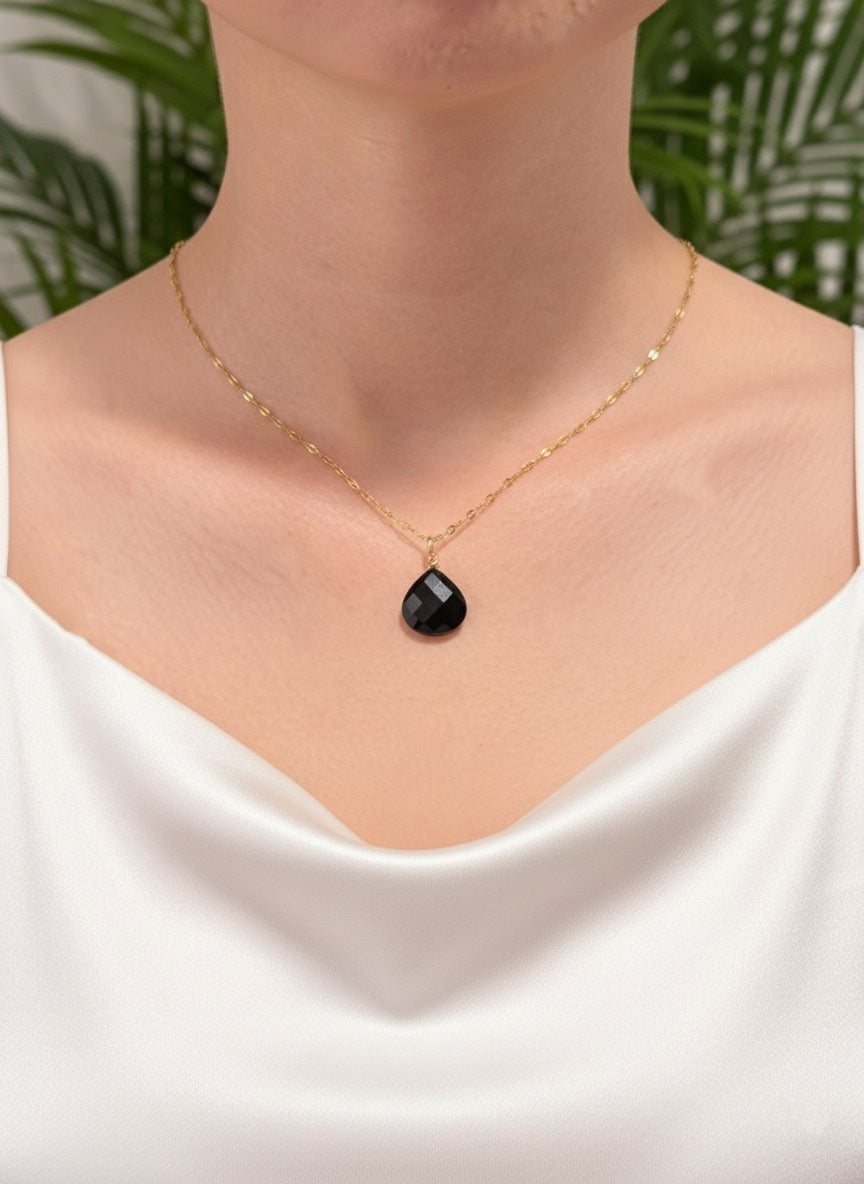 black onyx faceted teardrop necklace on model