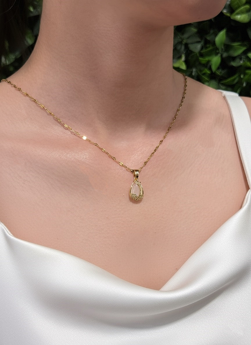 gold plated opalite necklace on cushion