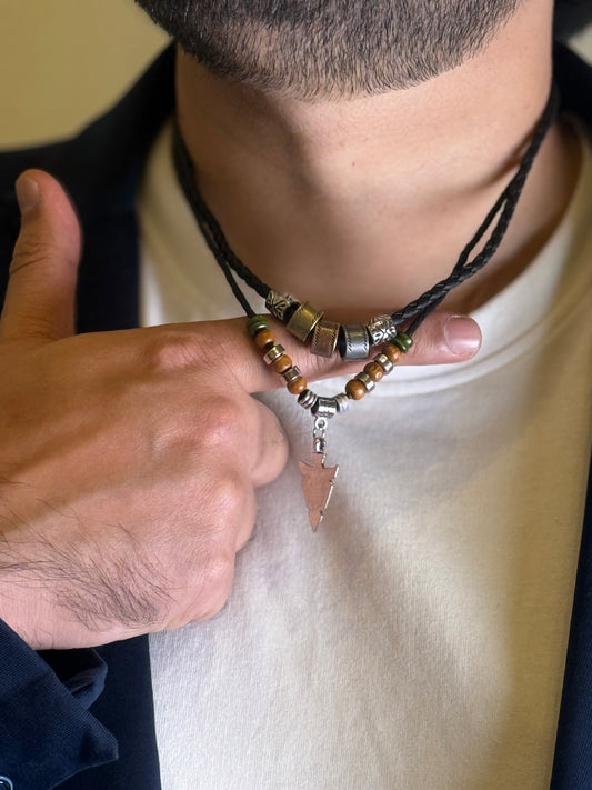 Men wearing tribal arrow necklace close-up