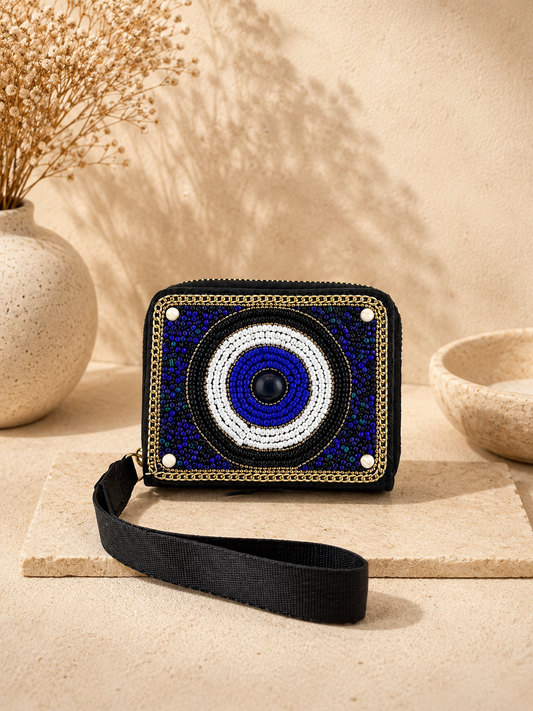 Small handbag with a blue and white circular design on a beige surface
