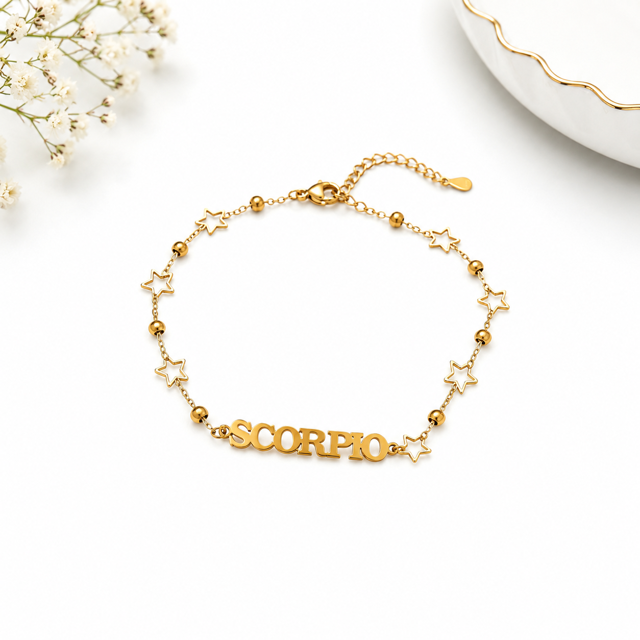 Gold bracelet with 'SCORPIO' on a white background