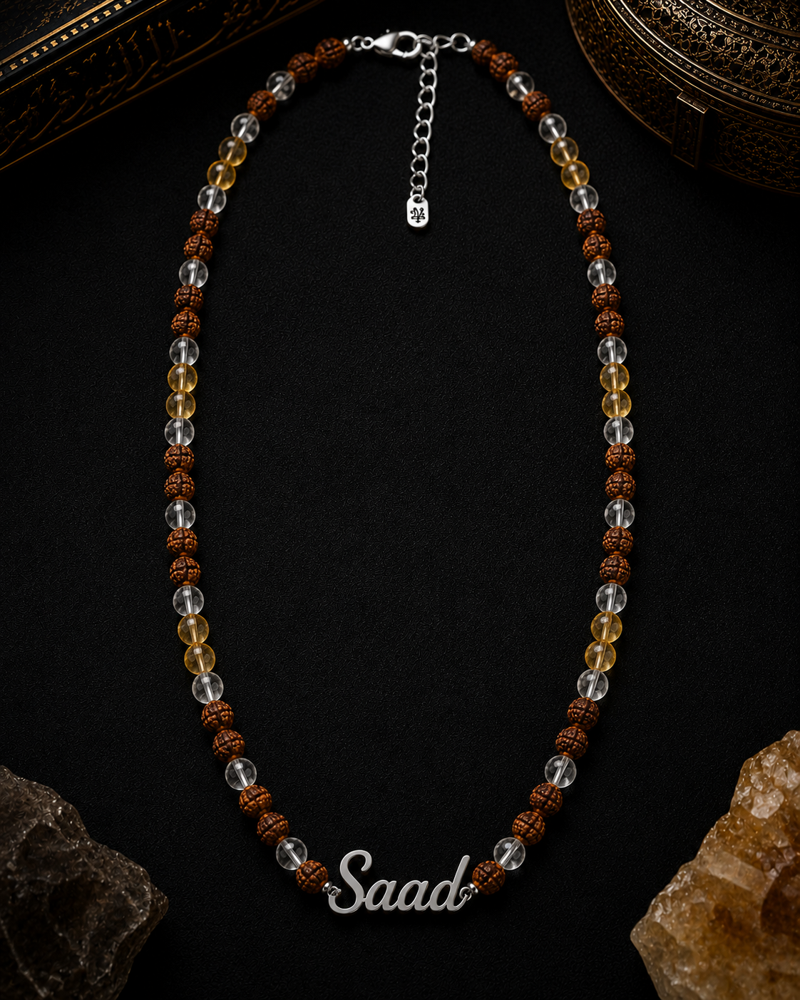 Necklace with 'Saad' inscription on a dark background