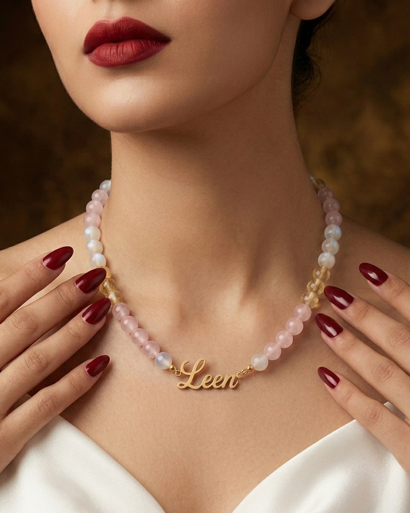 Woman wearing a 'Leen' necklace with a soft focus background