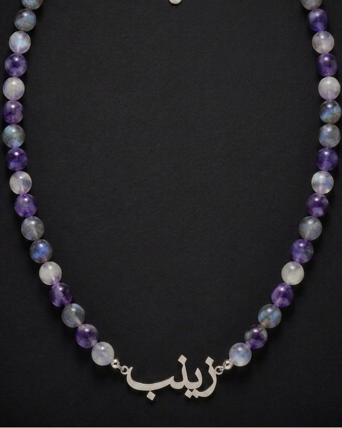 Necklace with multicolored beads on a black background