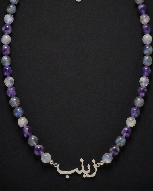 Necklace with multicolored beads on a black background