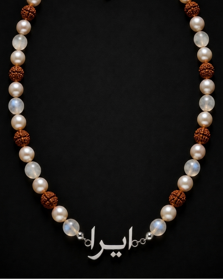 Necklace with pearls and brown beads on a black background