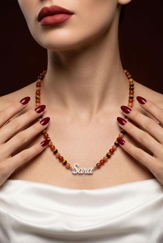 Necklace with 'Sara' pendant worn by a person with red lipstick and white top.