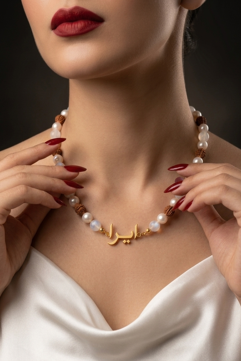 Woman wearing a pearl necklace with gold accents, close-up on neck and shoulders.