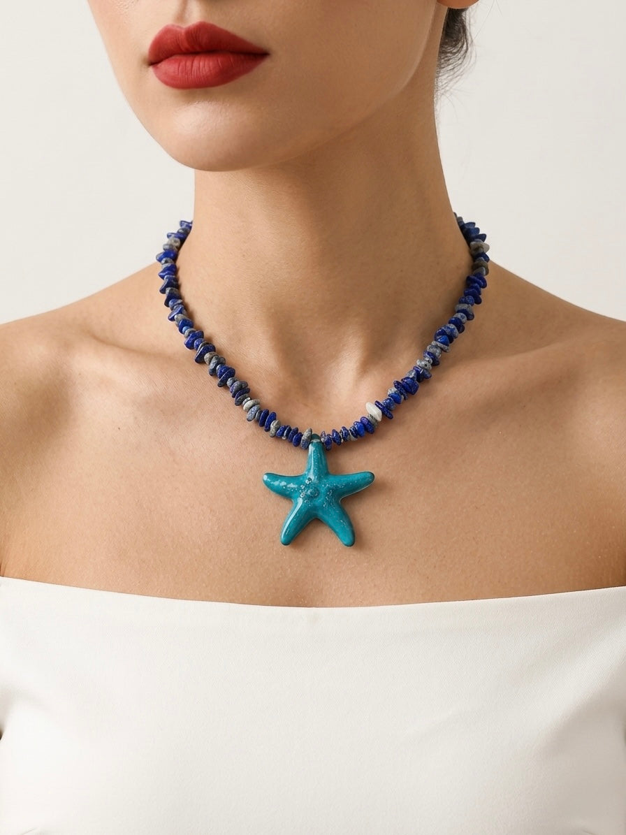 Necklace with a starfish pendant worn by a model against a neutral background