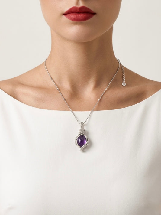 Necklace with a purple pendant worn by a person on a white background