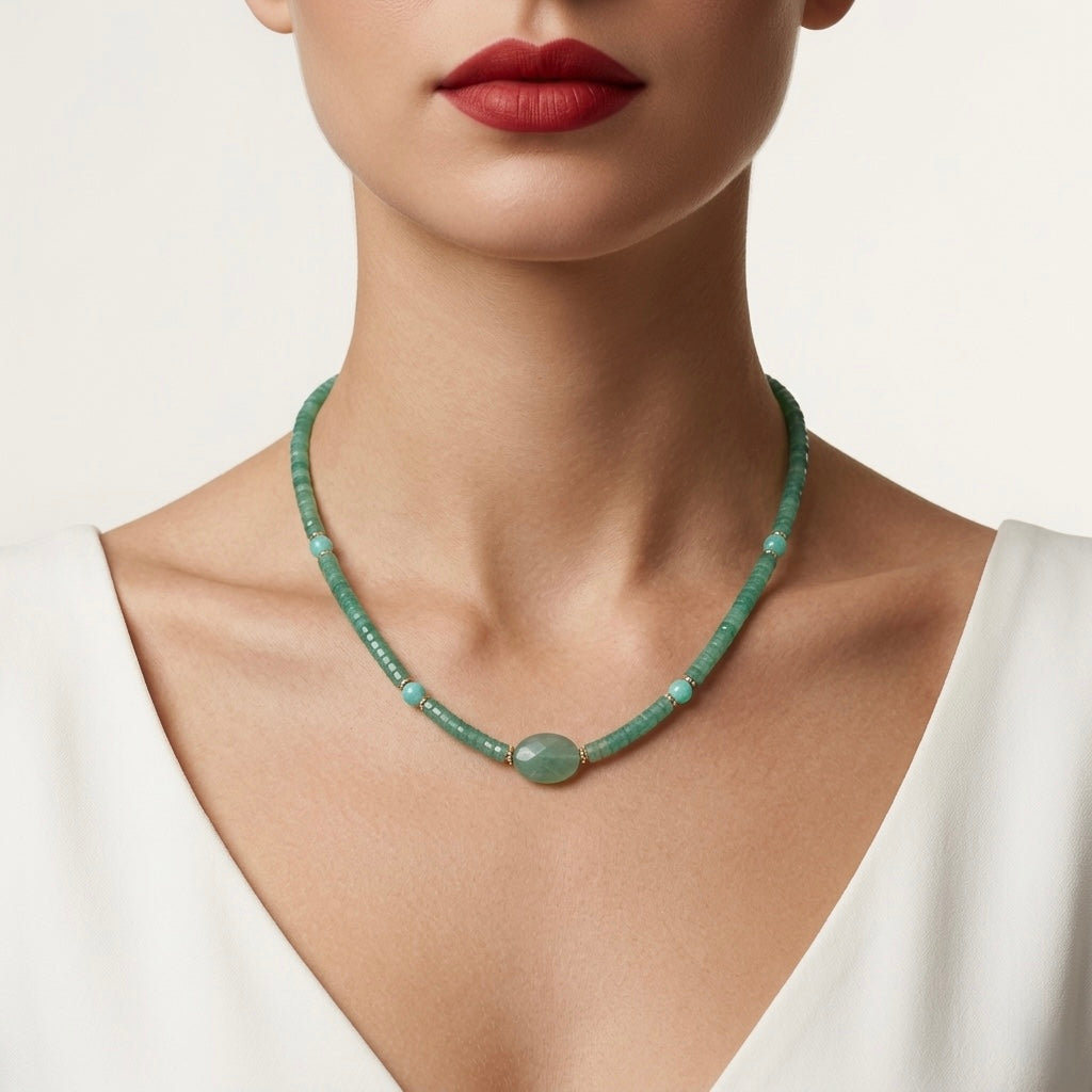 Green beaded necklace worn by a model on a plain background