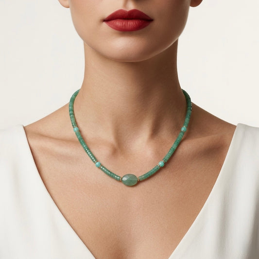 Green beaded necklace worn by a model on a plain background
