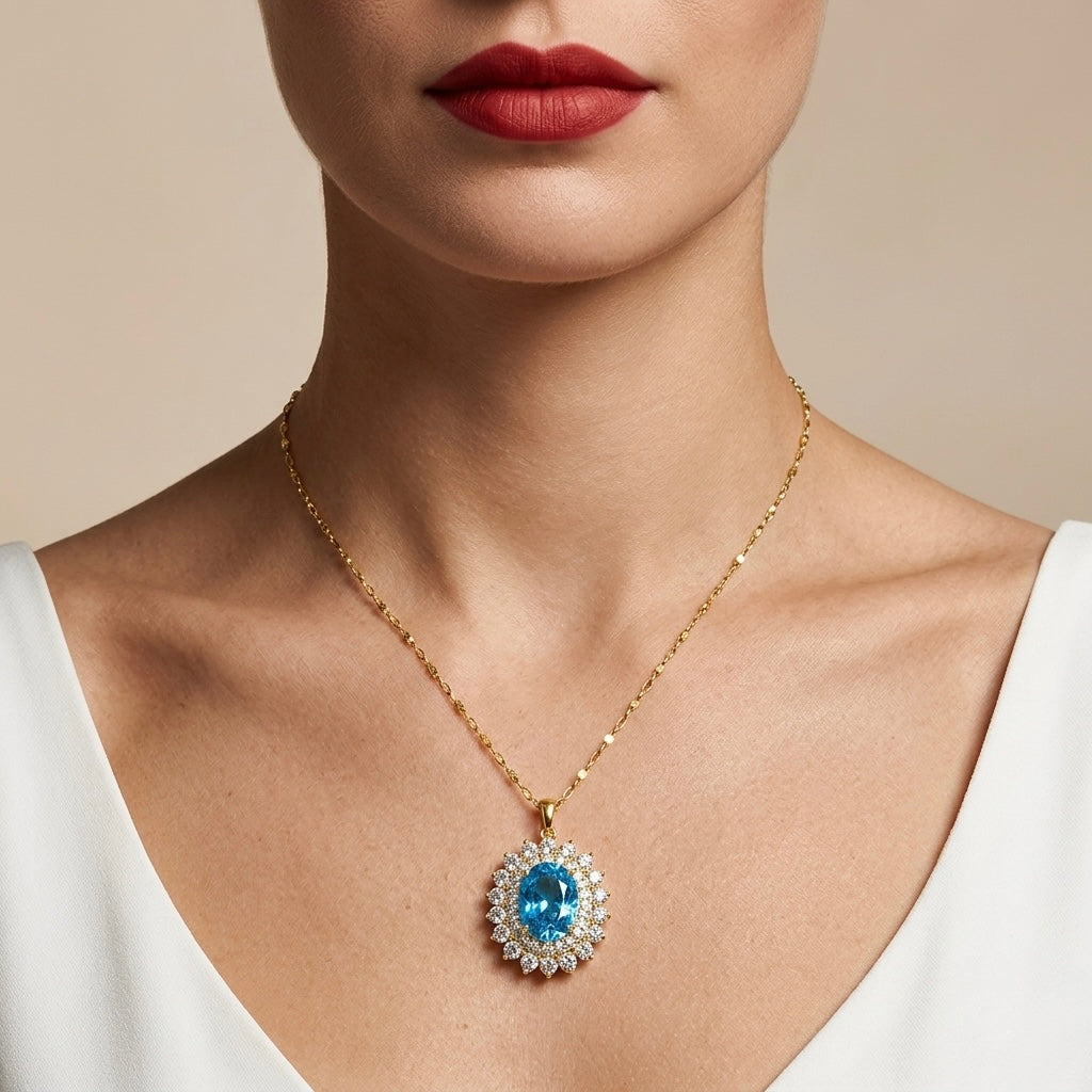 Necklace with a blue gemstone pendant worn by a person