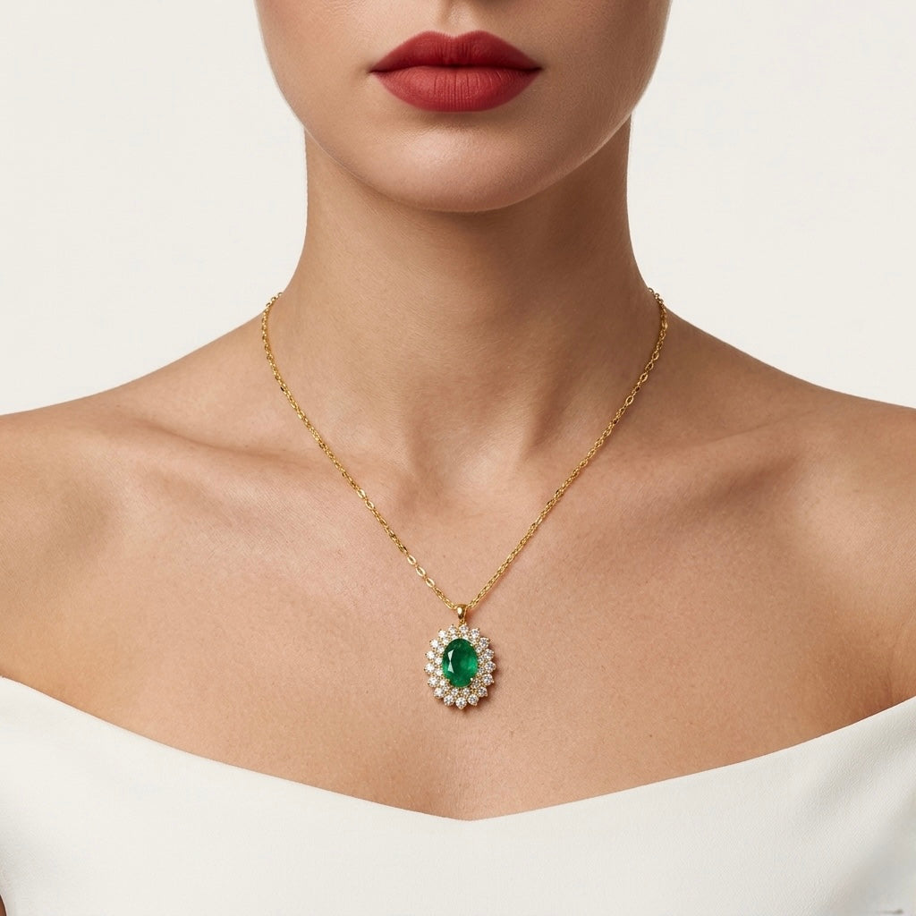 Gold necklace with a green gemstone pendant worn by a model
