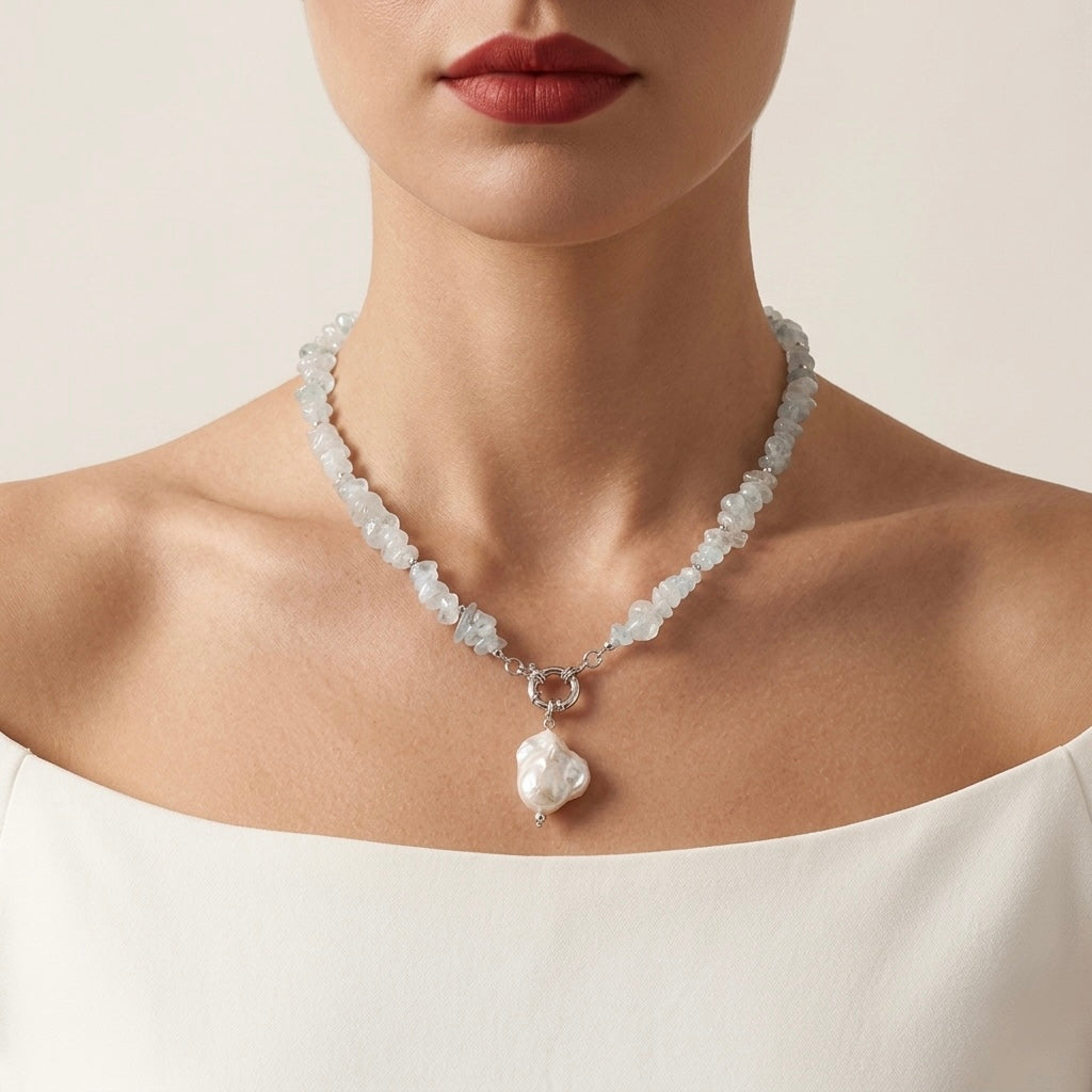 Necklace with a heart-shaped pendant worn by a model against a neutral background