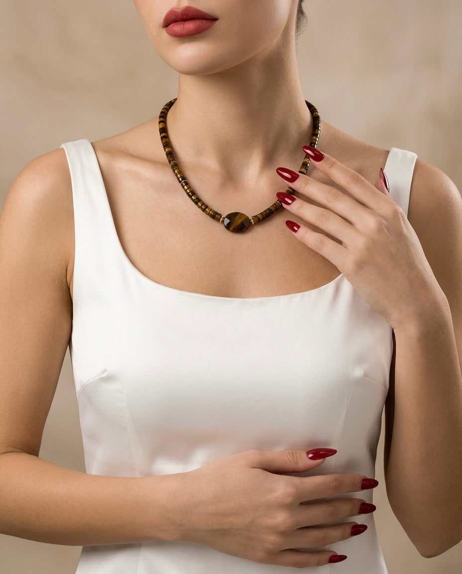 Woman wearing a necklace with a neutral background