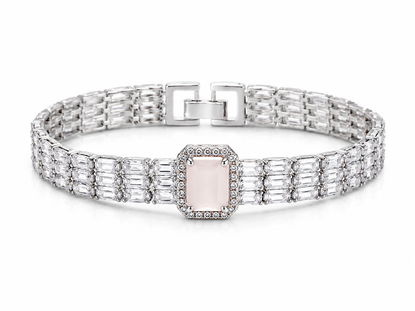 A silver-toned link bracelet featuring a central rectangular pale pink gemstone surrounded by small clear stones, with baguette-cut side stones and a square clasp, shown on a white background.